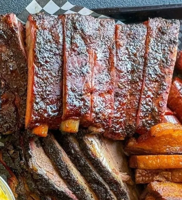 Close crop of glazed ribs from the official Vargas BBQ tray